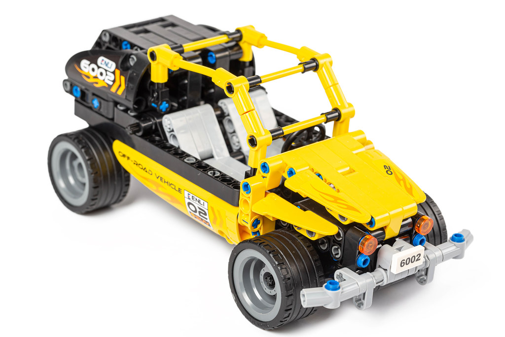 Yellow toy jeep made from a constructor Yellow toy jeep made from a constructor