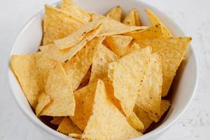 The tortilla chips in bowl The tortilla chips in bowl